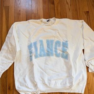The Bar White Crewneck Sweatshirt with Light Blue "FIANCÉ" Lettering